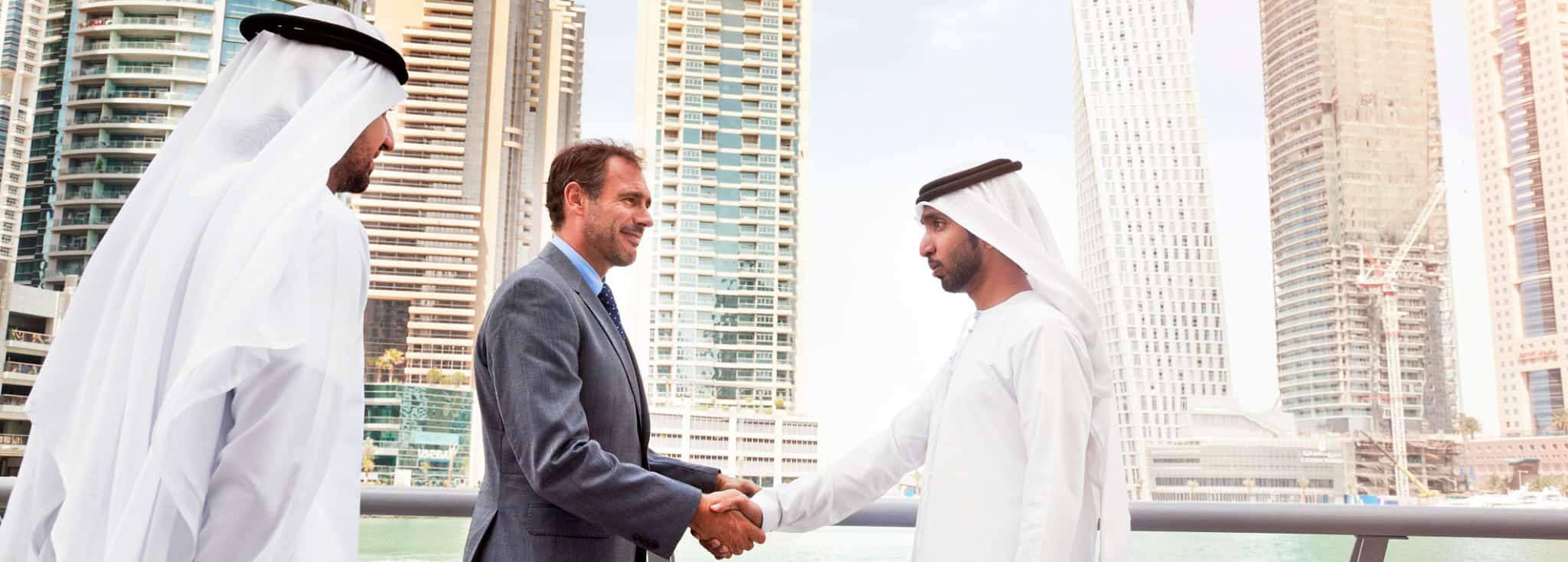 Businessmen struck a deal in Dubai. Shoot from istockalypse Dubai 2015.