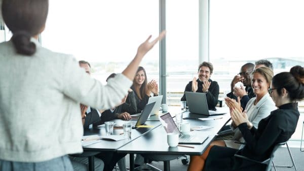 Business people in large modern meeting room